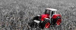red-tractor-in-the-grass.jpg